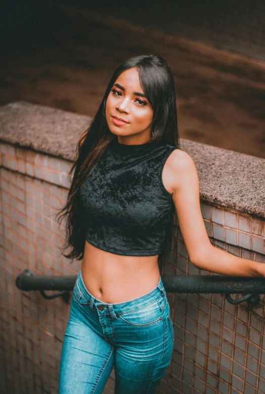 a woman leaning against the wall with her arms outstretched