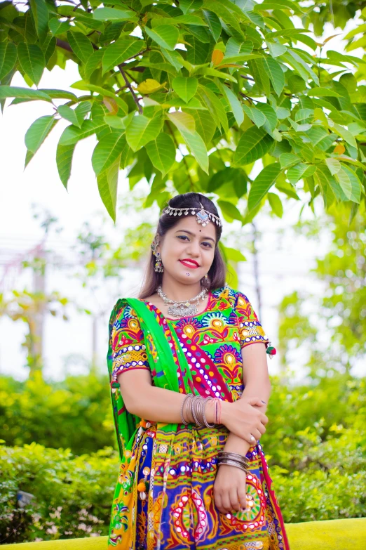 an indian woman in traditional dress smiling for the camera
