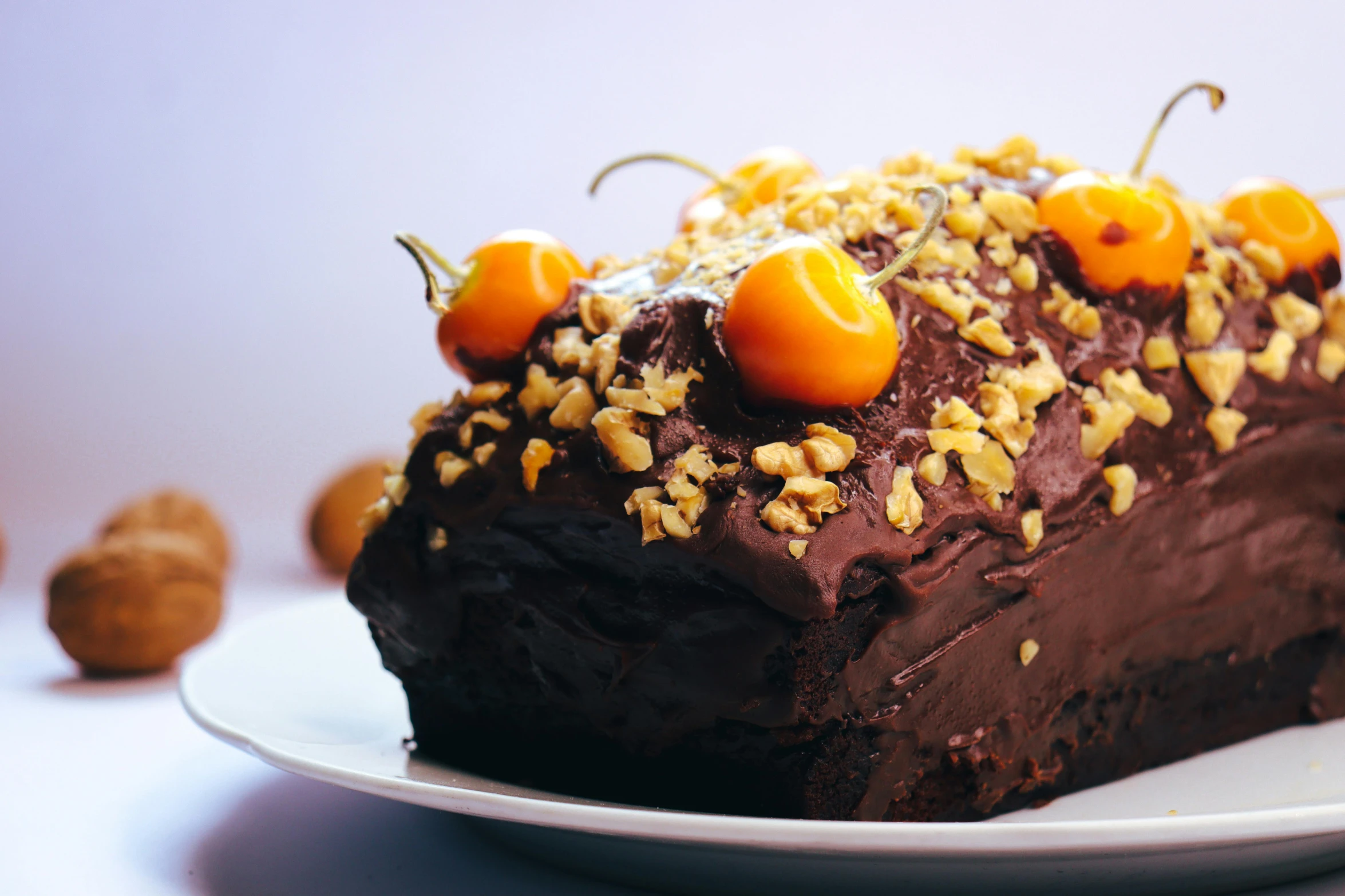 the piece of chocolate cake is topped with cherries