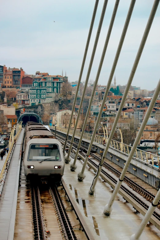 a passenger train is moving along the railroad tracks