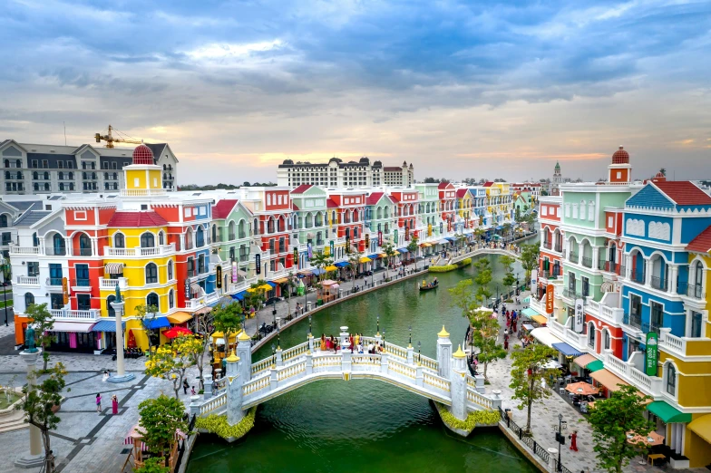 colorfully painted buildings line the waters edge in a small river