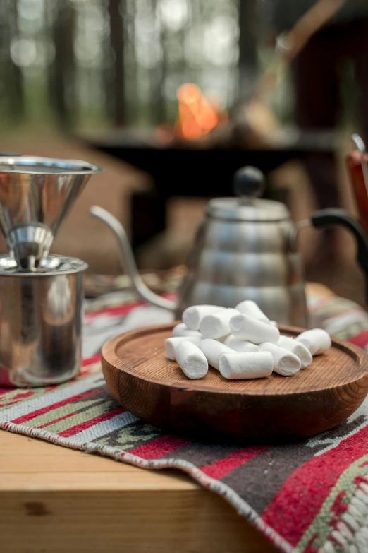 there is small marshmallows on a plate on a table