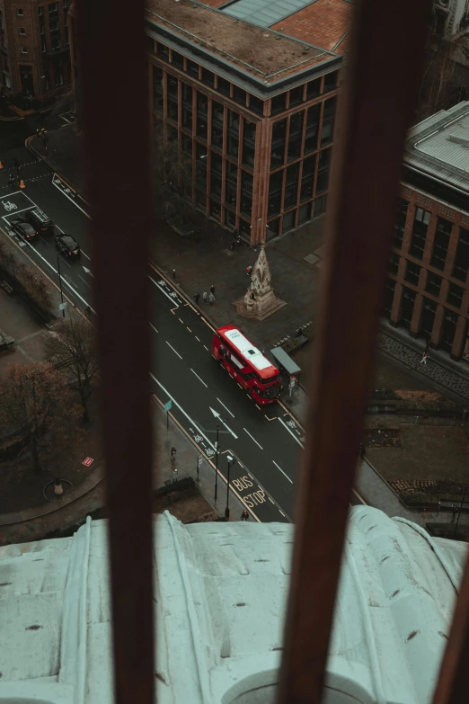 an overhead view of a bus parked near the sidewalk