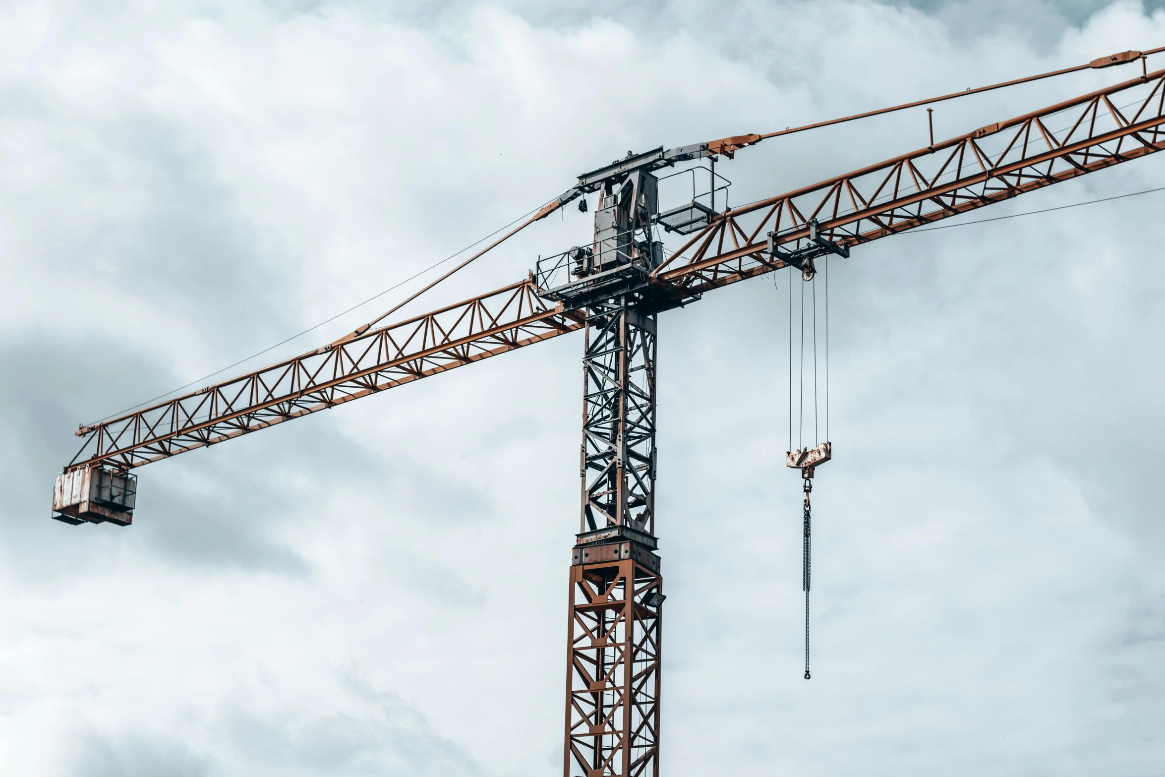 a crane on the top of a construction site