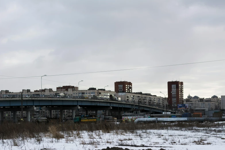 a city skyline with a bridge and buildings in the background