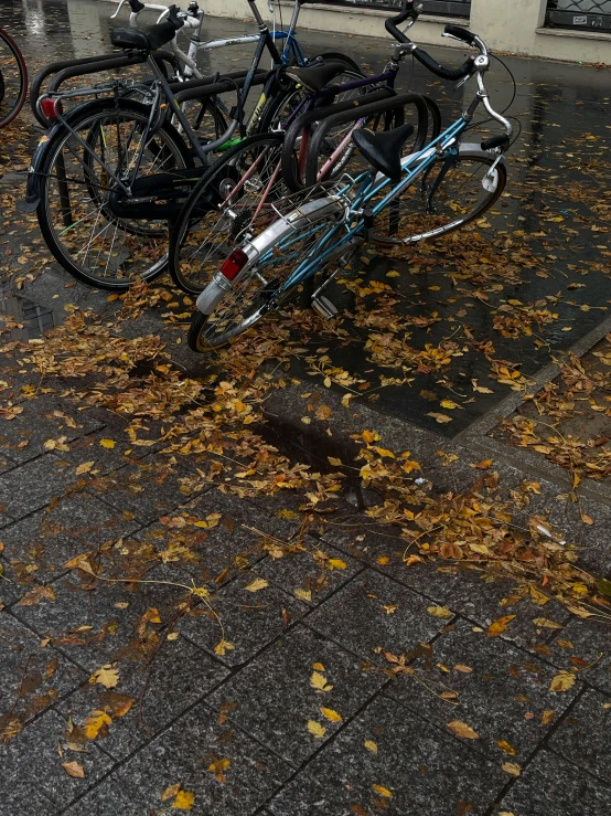 a rack full of bikes parked on a street