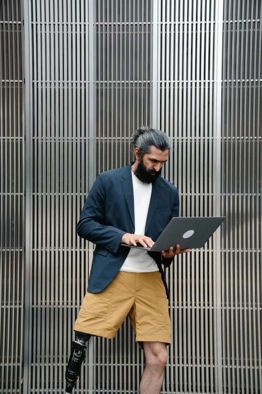 a man in an urban setting with a laptop