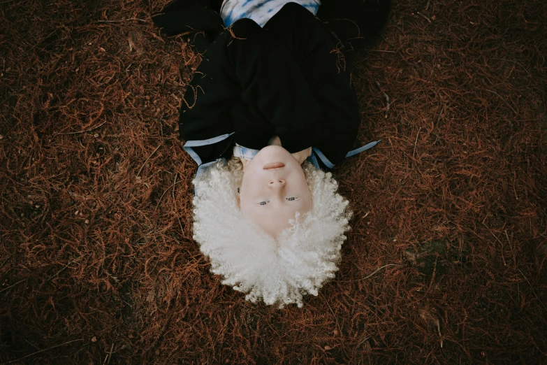 an overhead view of a person's foot on a fluffy piece of cloth