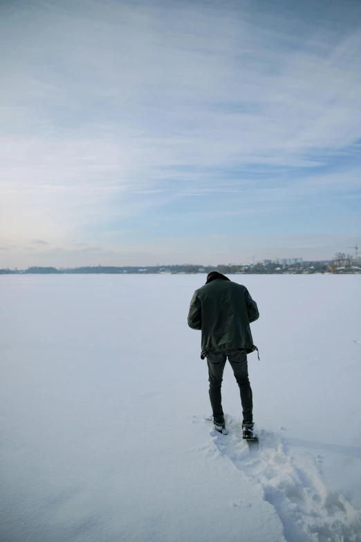 a person walking in the snow with no shoes