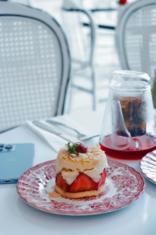 a red and white plate topped with a strawberry pie