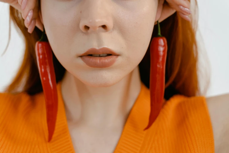 a woman in orange is posing for a po