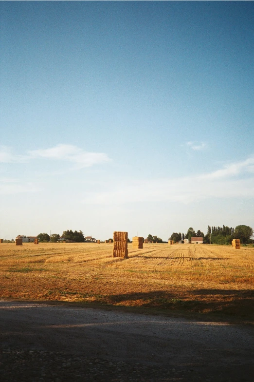 the tractor has pulled over hay in the open field