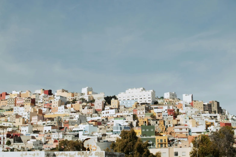 there is a mountain covered in lots of buildings