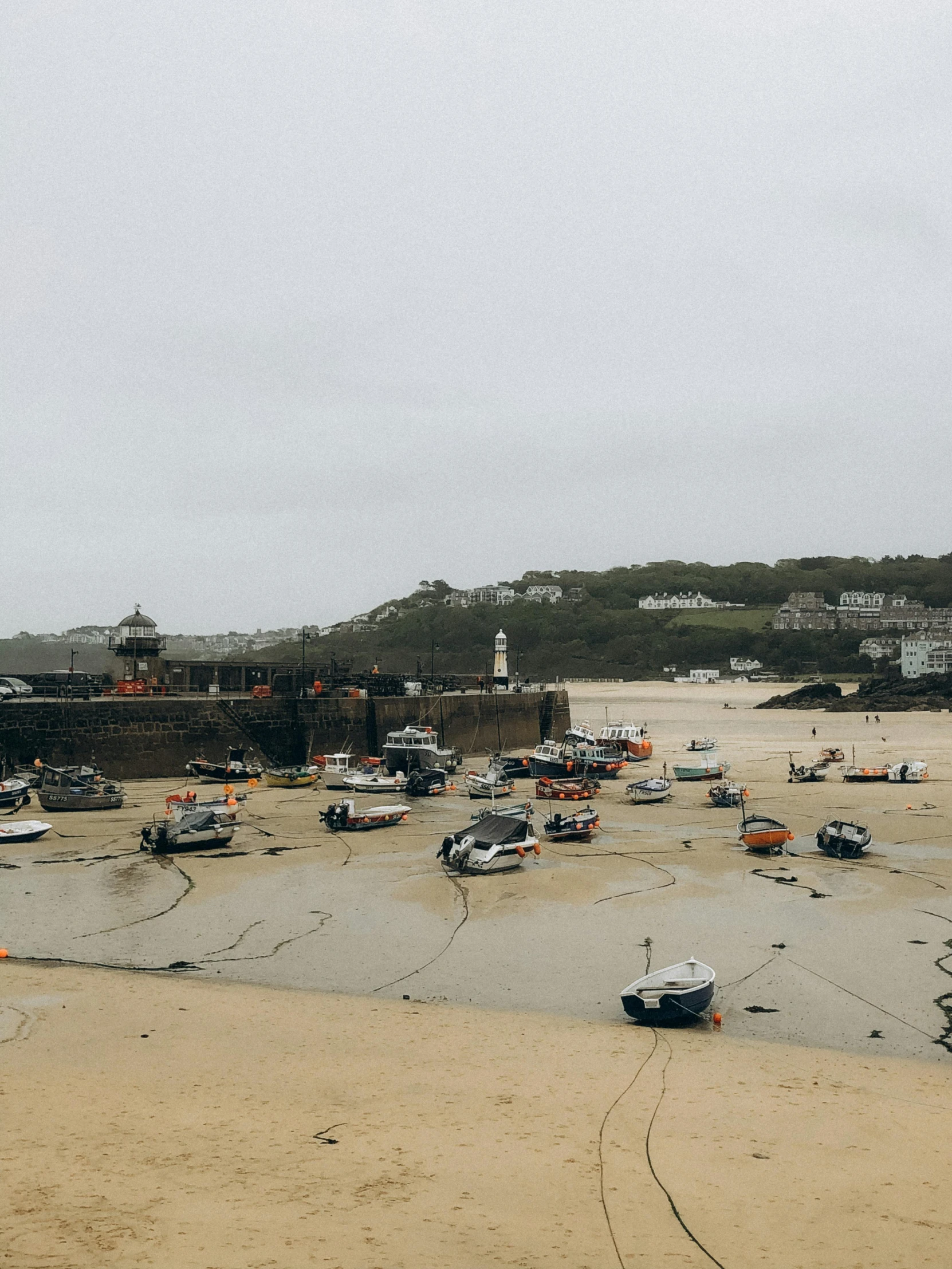 boats are parked in a large boat yard