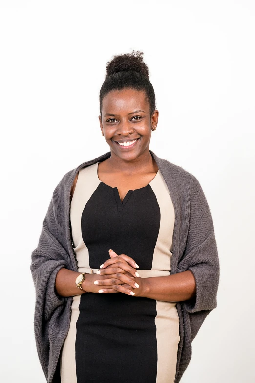 woman posing in front of a white wall