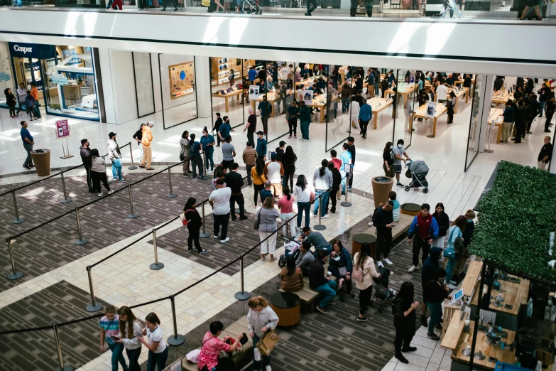 a mall filled with people and a building with multiple floors