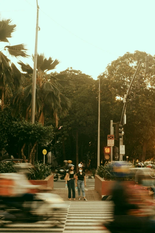 two men cross the street at an intersection