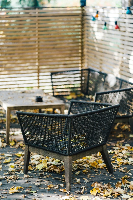 two chairs and a table on an outside patio