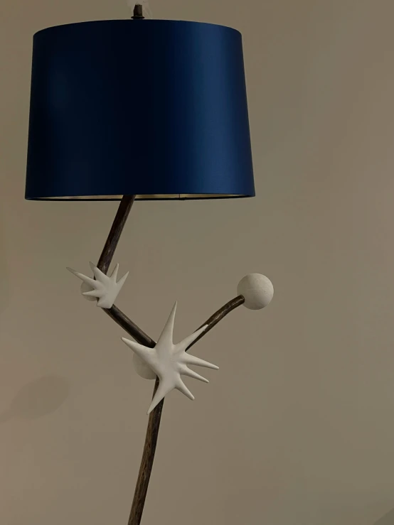 a table lamp that has been made out of ceramic and plastic