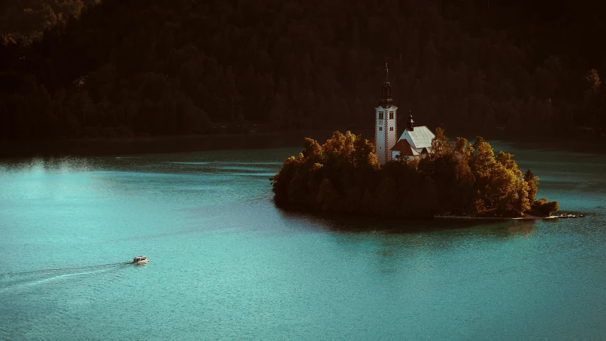 a small island is in the middle of a body of water