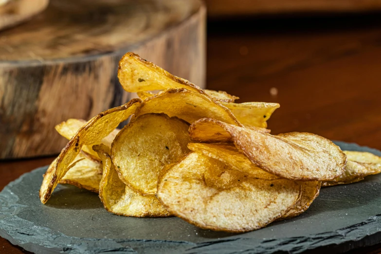 a blue plate topped with crispy potato chips