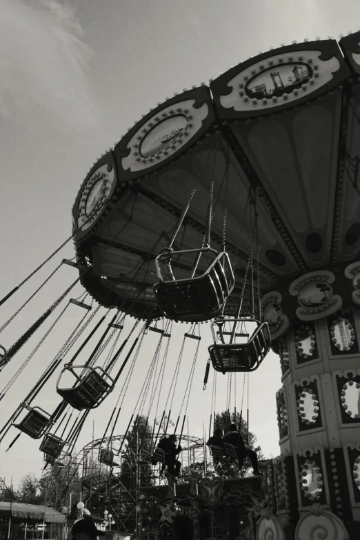 several swing carousels being displayed on a carnival