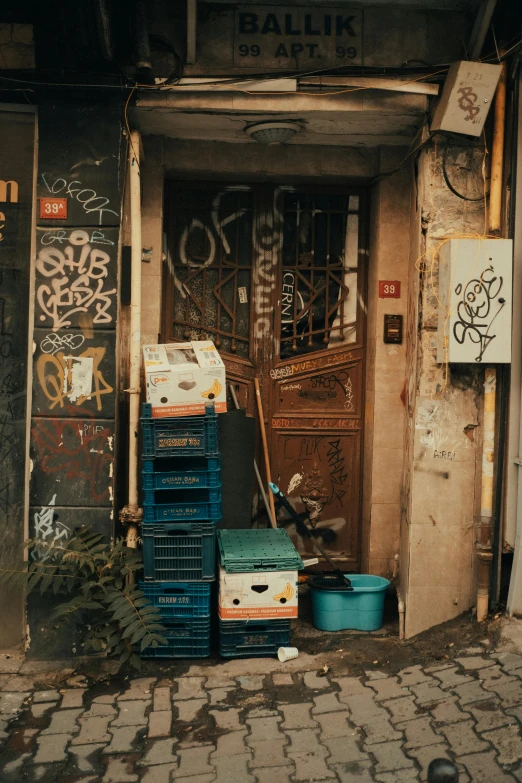 an alleyway that has a bunch of boxes in front of it