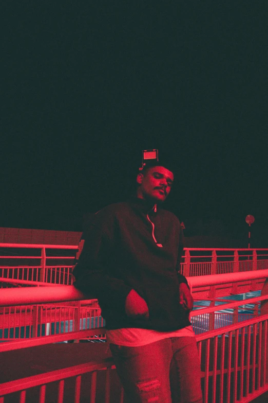 the woman stands on the walkway over the bridge