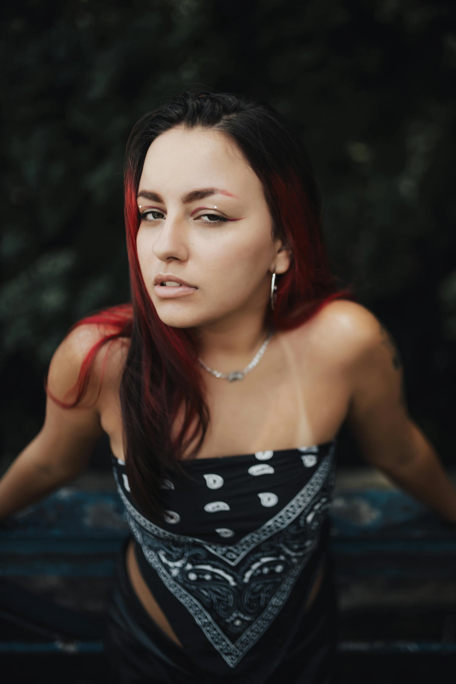a woman with red hair is posing for the camera