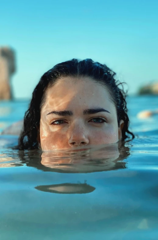 a close - up of a woman submerged in the water