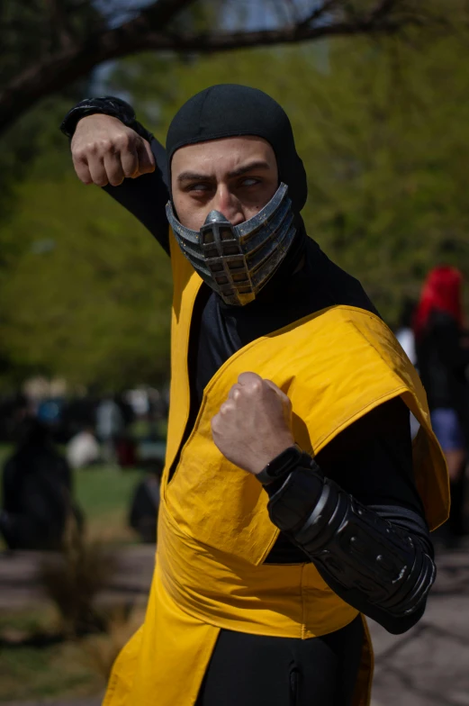 a man dressed as a superhero posing for a po