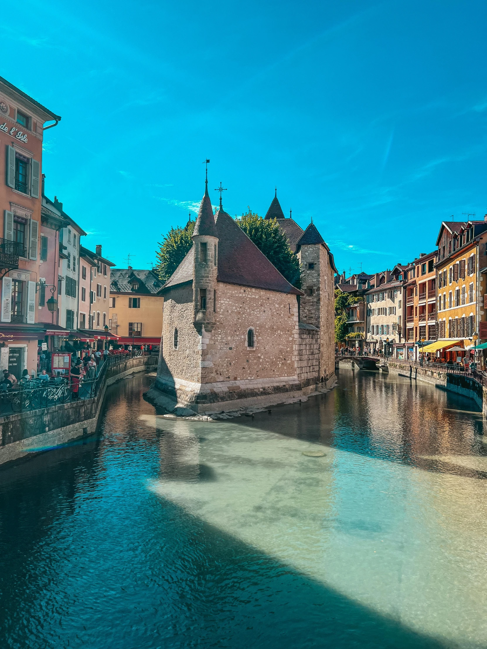 buildings along the river with an old clock tower