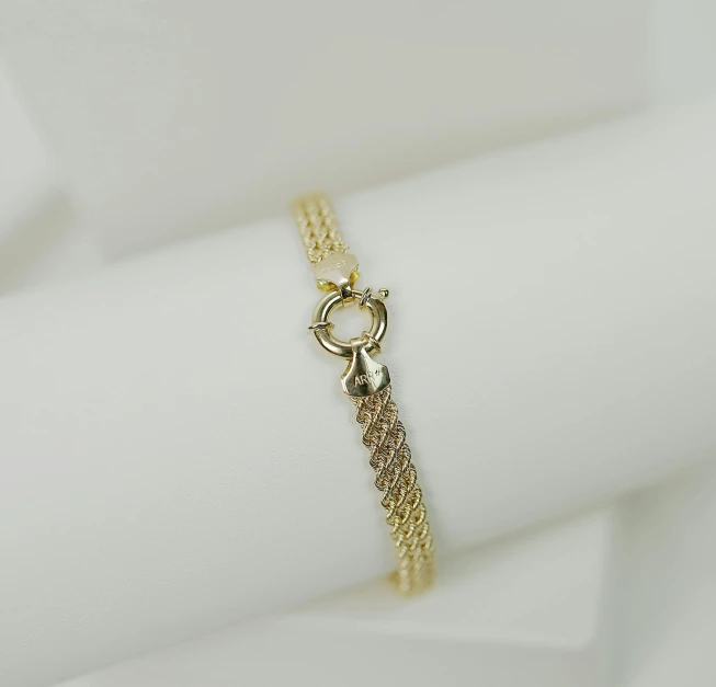 a gold chain celet with a lobster clasp