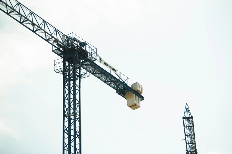 large crane in the air on top of metal structures