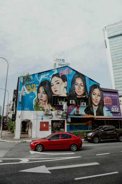 a big building with large pictures of woman's faces