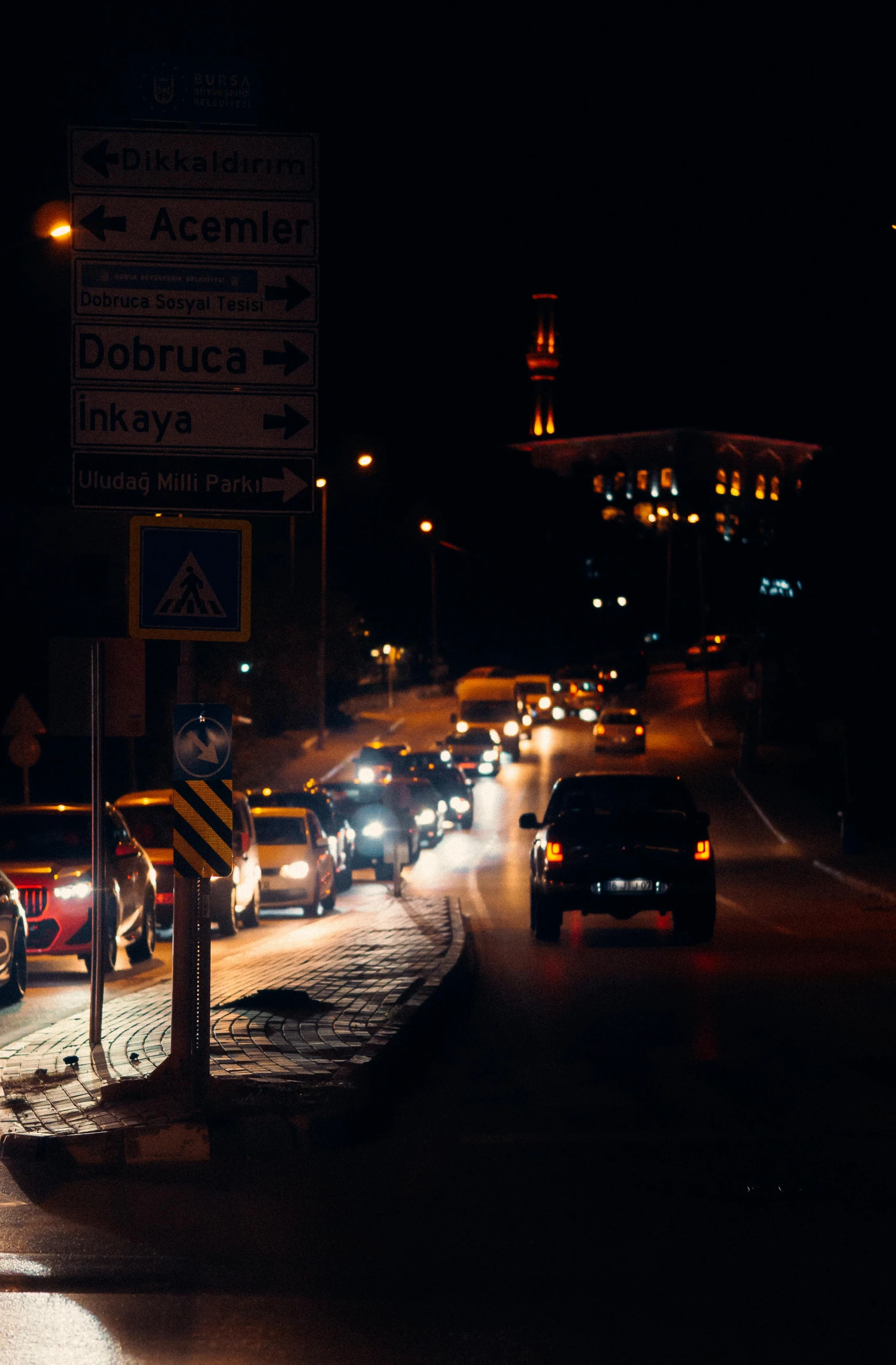 many cars on the road with a lot of lights