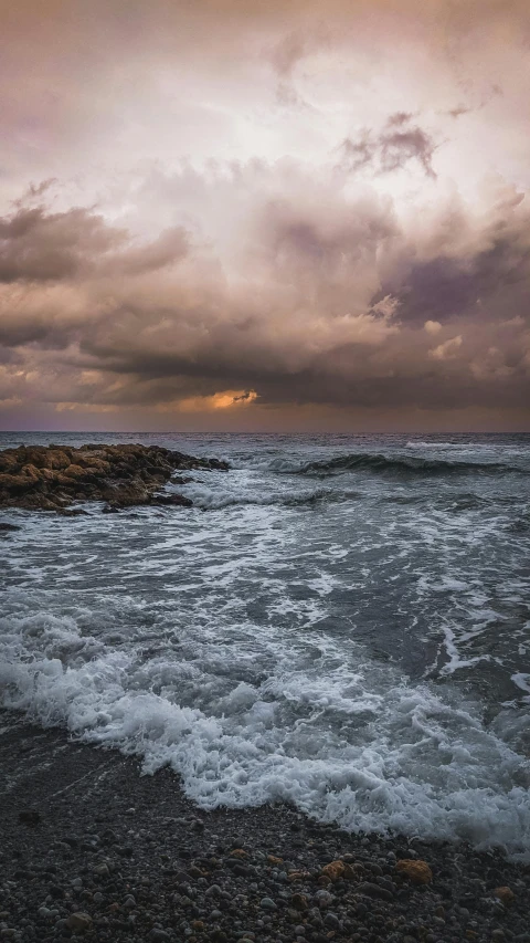 the storm rolls in over the ocean as we look out at the horizon