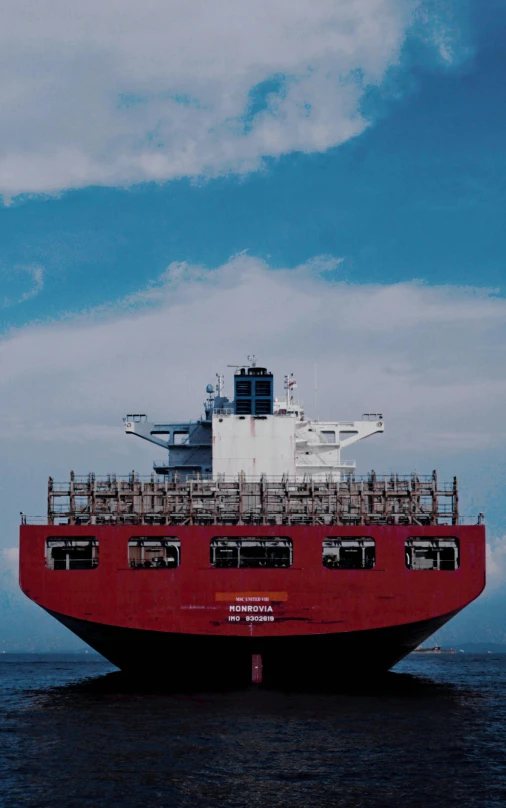 an aircraft carrier in the middle of an ocean