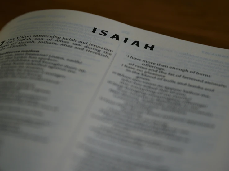 the words isdah written on top of an open bible