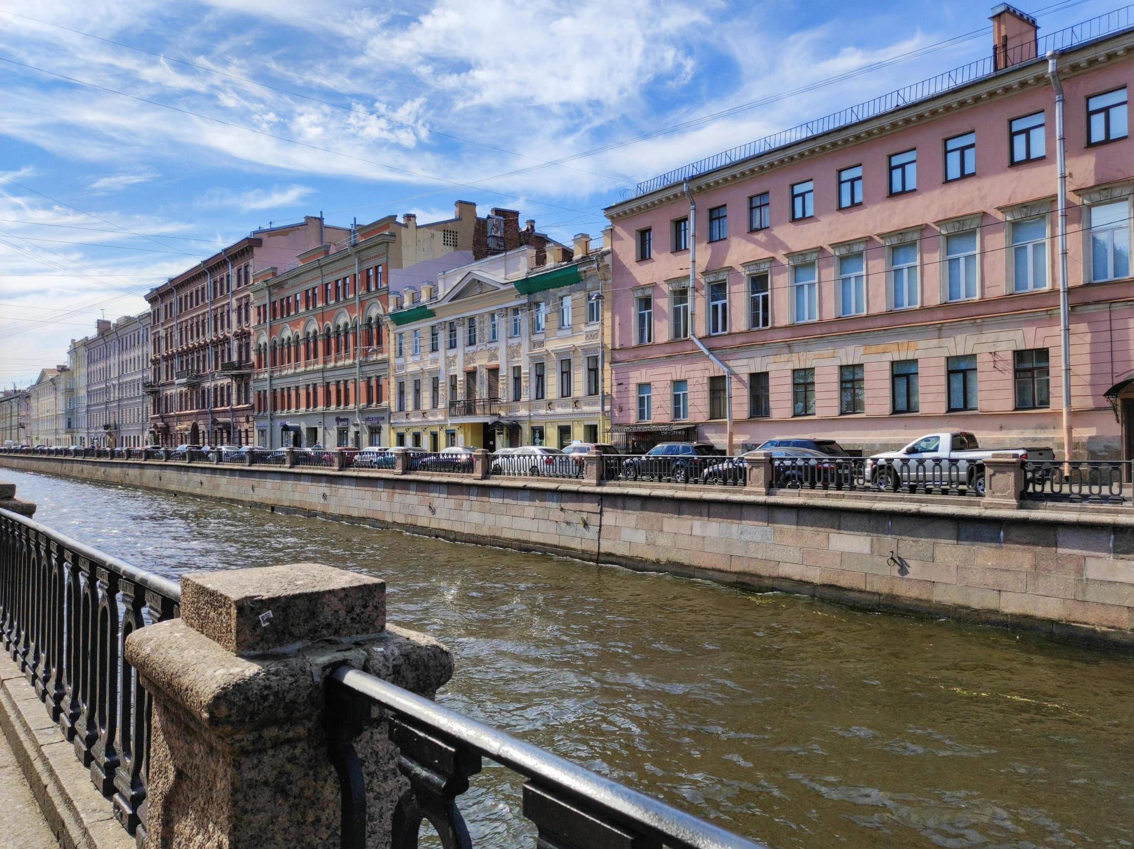 several very big buildings next to a river