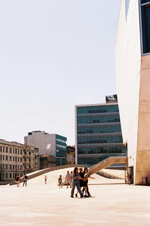 people walking around in an open concrete area