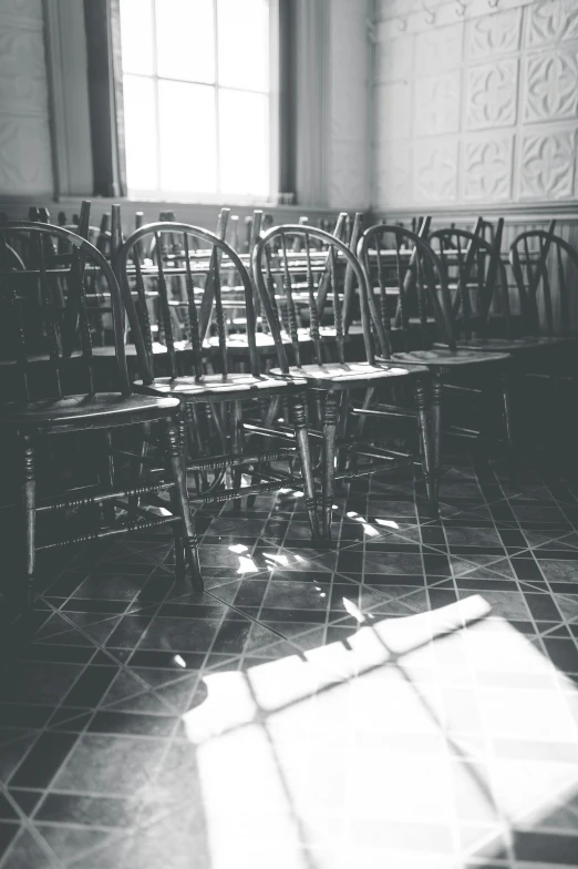 black and white po of a set of chairs with wooden back