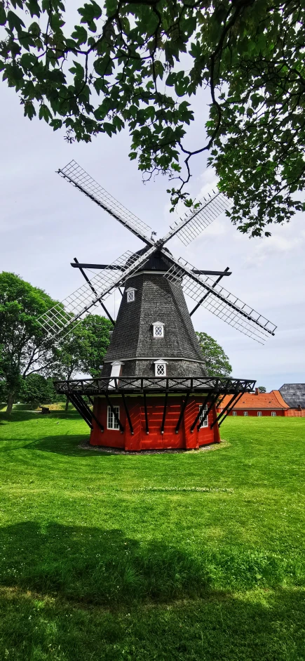 the red structure is surrounded by grass