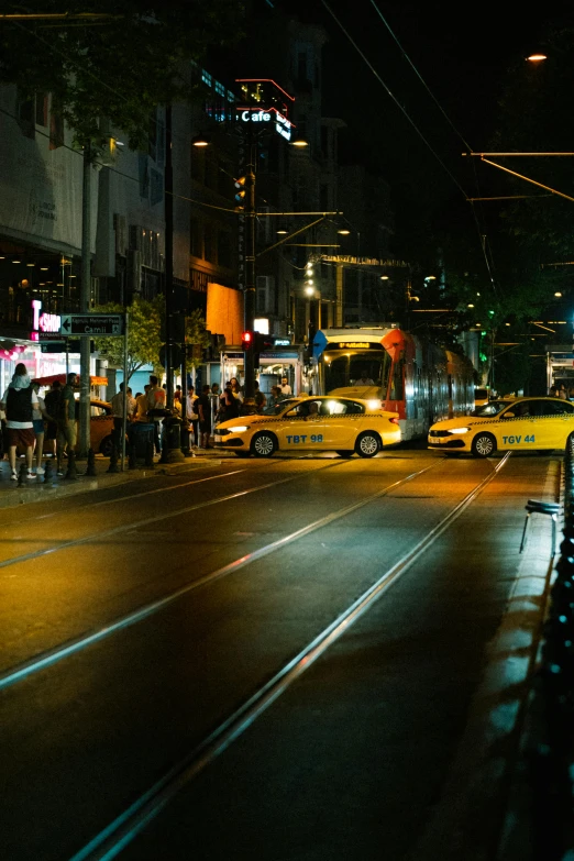 city street at night with lots of traffic