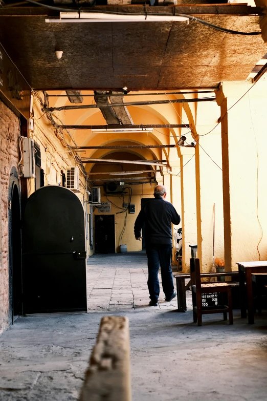 a man walking up and down an old building