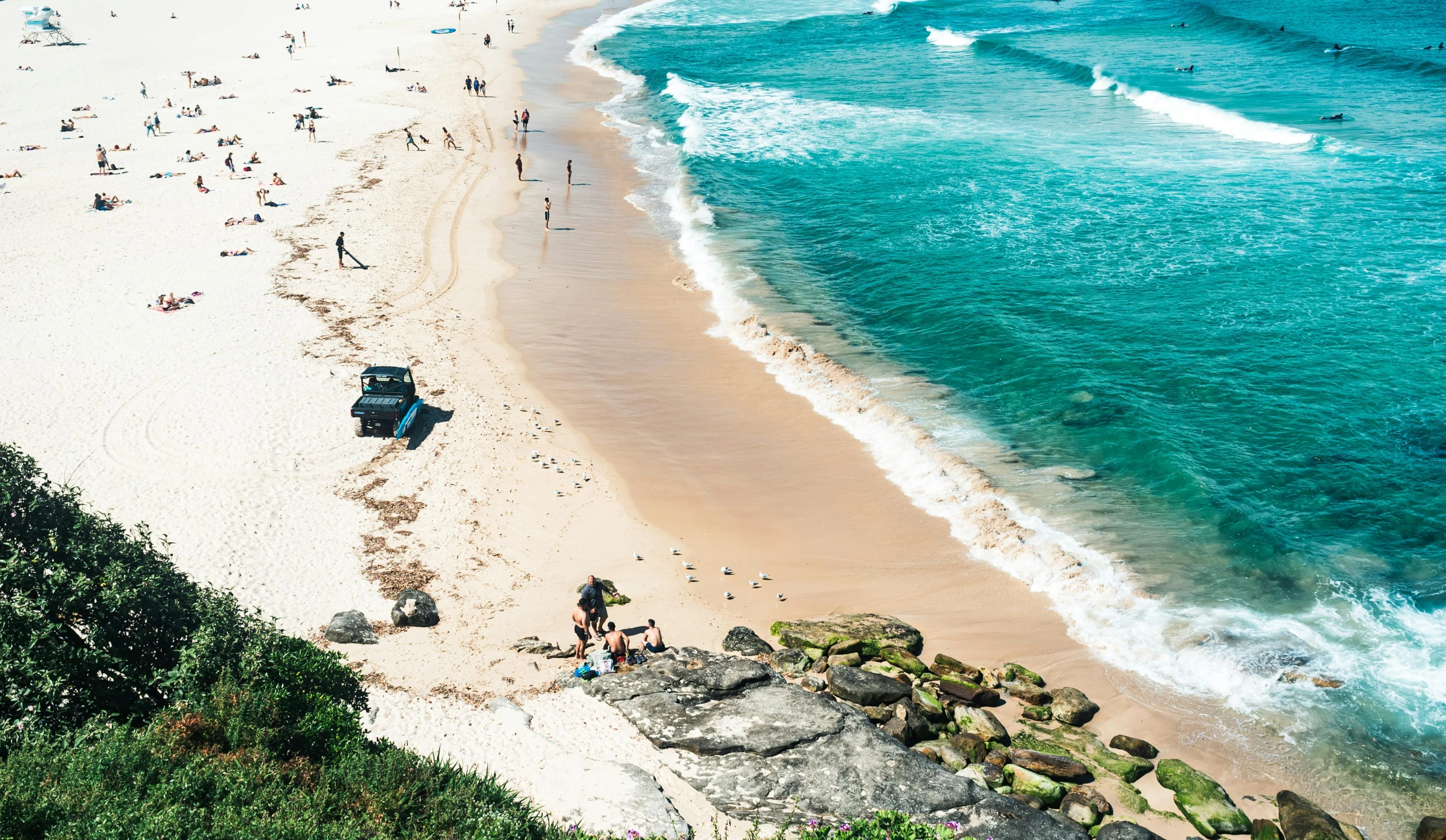 a white sandy beach near a body of water