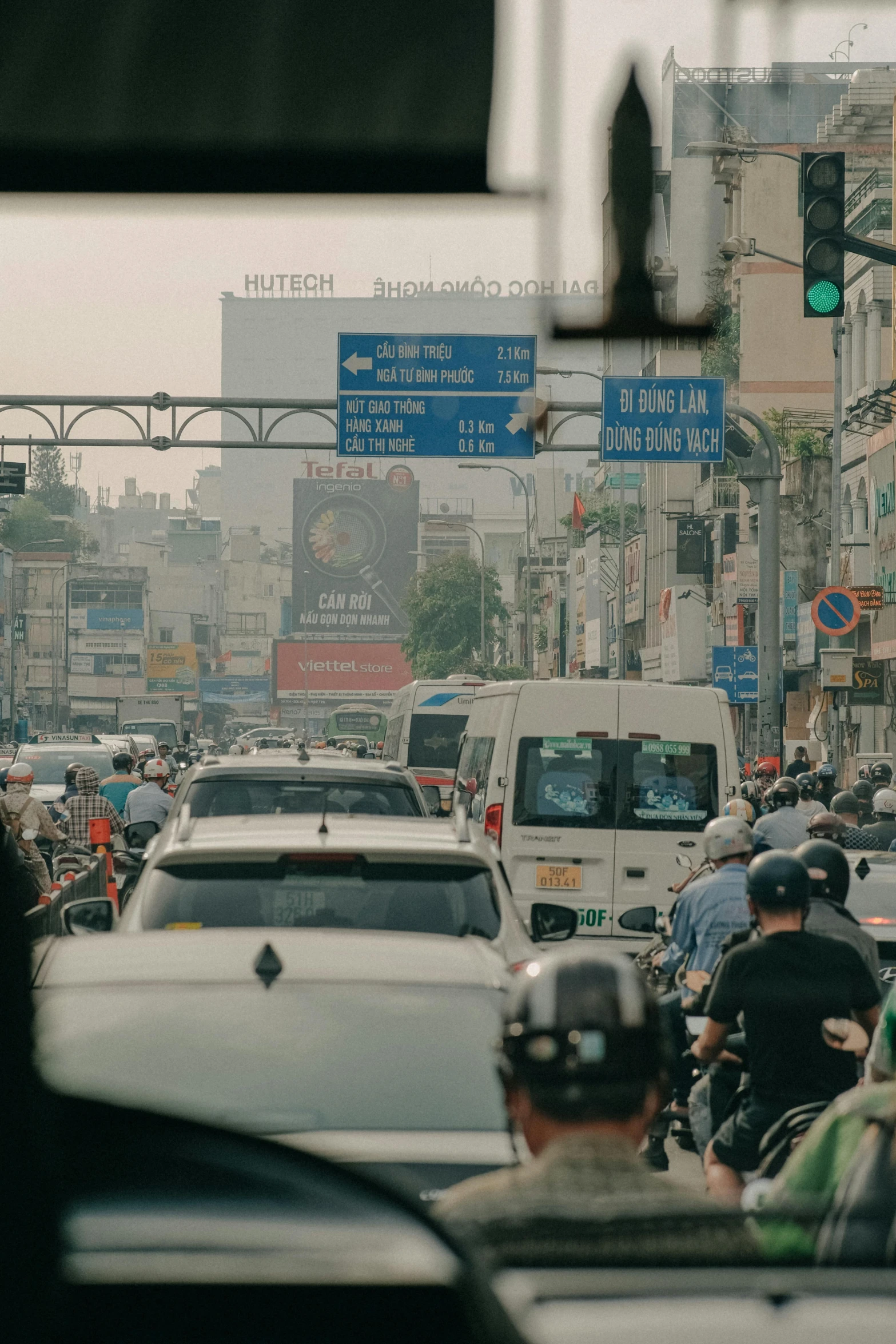 traffic moves along the crowded city street at an intersection