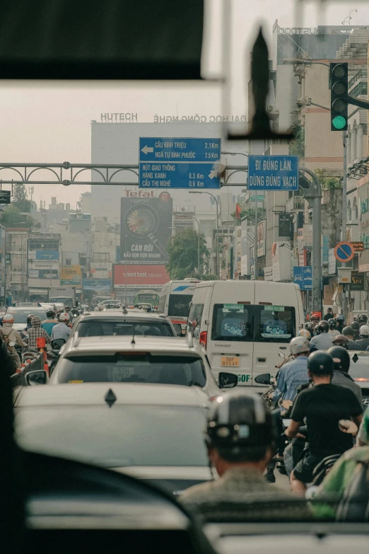 traffic moves along the crowded city street at an intersection