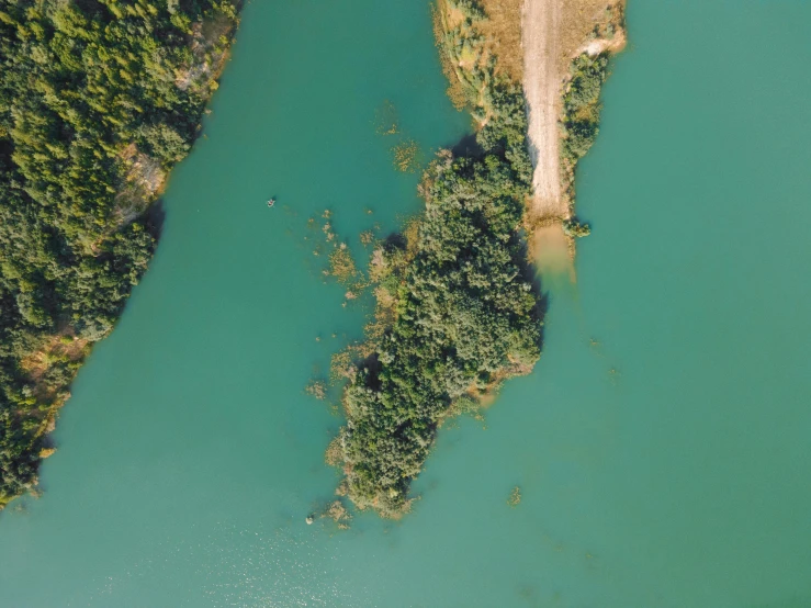 the aerial view of the water that looks like a river