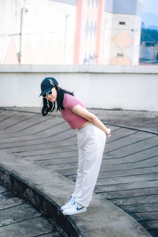 the woman is practicing her golf swing with a coach